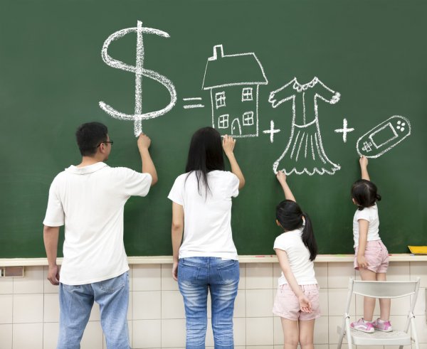 family drawing on green board with big dollar sign