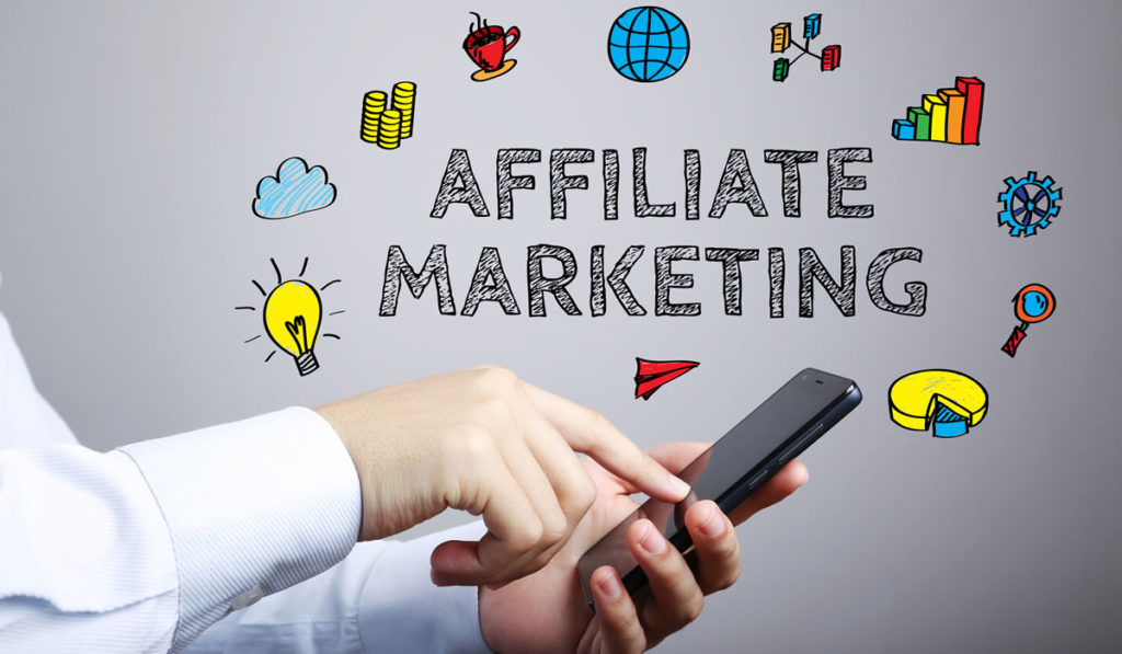 affiliate marketing malaysia word with hand touching mobile phone